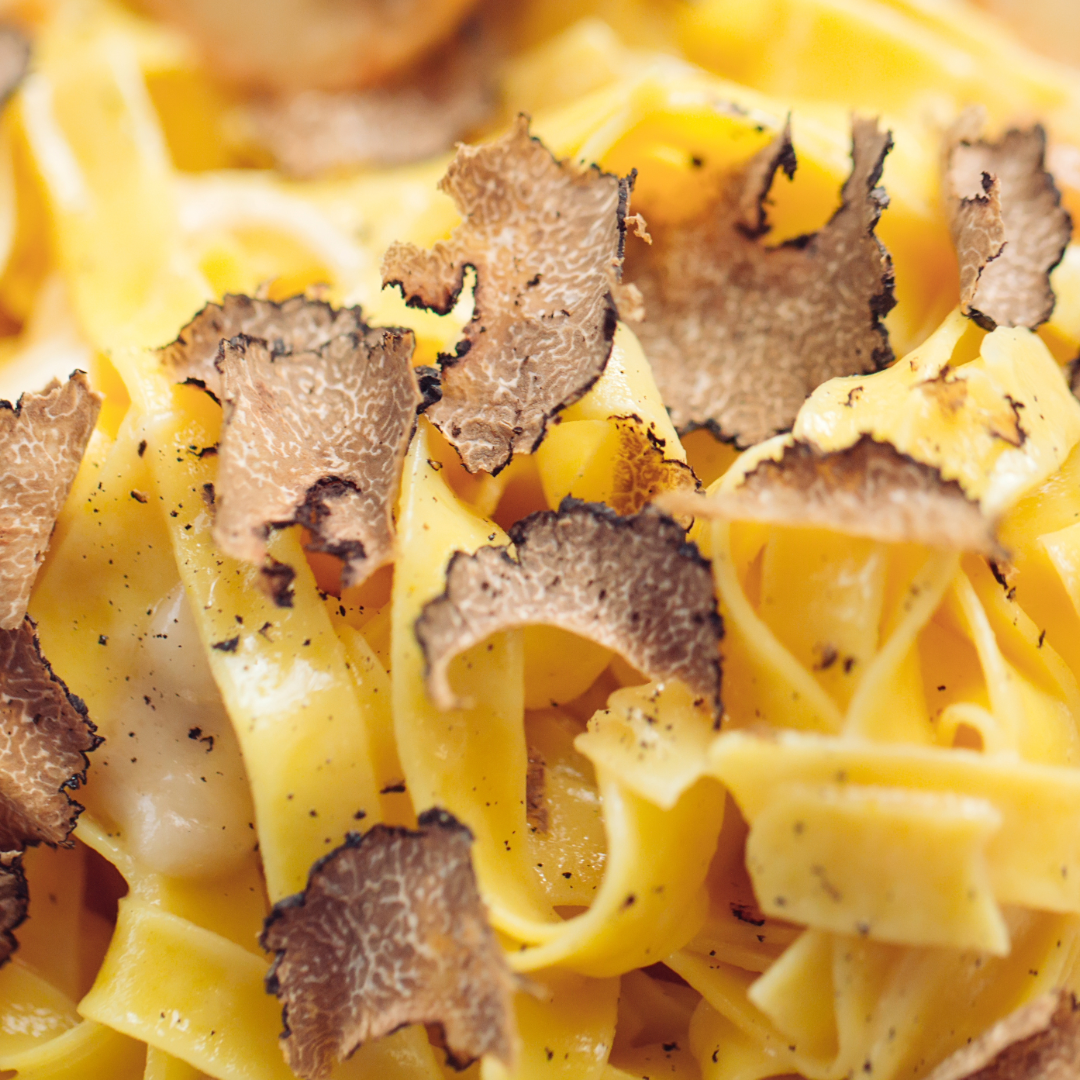 Tagliatelle Pasta Topped with Black Truffle Slices
