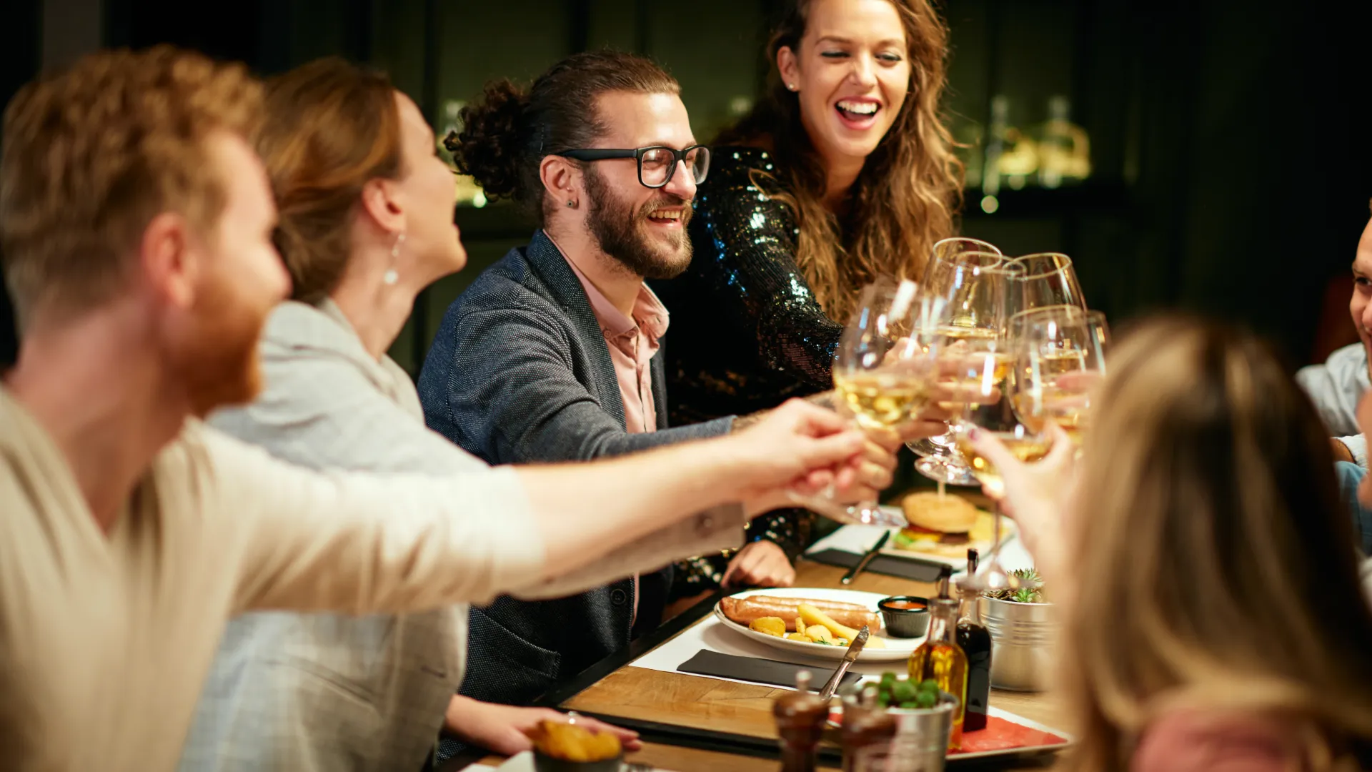 Dinner Guests Cheersing
